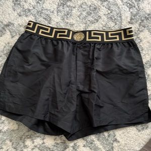 Versace mid-length Greta Border Swim shorts.